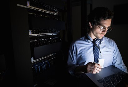 An IT technician is working on data protection.